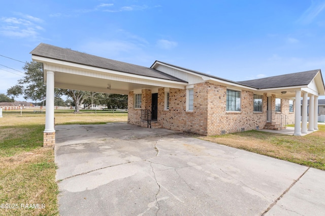 ranch-style house with a front lawn and a carport