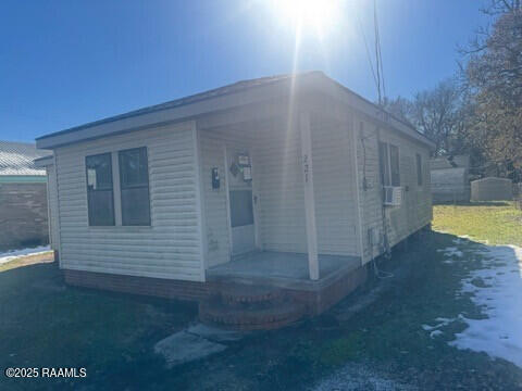 view of front of house with cooling unit