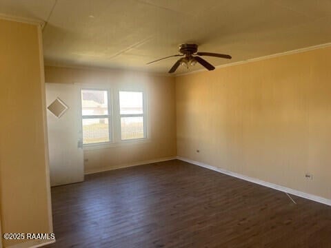 empty room featuring ceiling fan, ornamental molding, and dark hardwood / wood-style floors