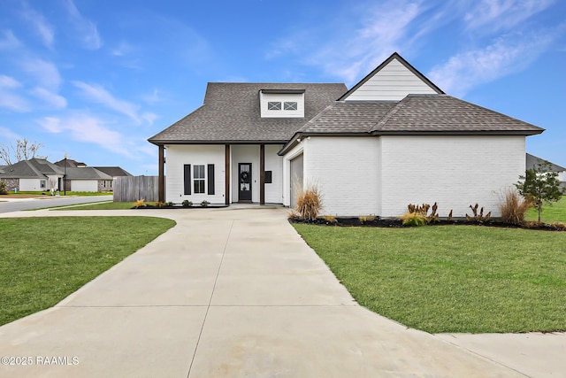 view of front of house featuring a garage and a front yard