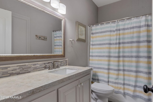 full bathroom with vanity, shower / tub combo, decorative backsplash, and toilet