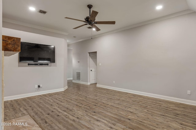 unfurnished living room featuring hardwood / wood-style flooring, ornamental molding, and ceiling fan