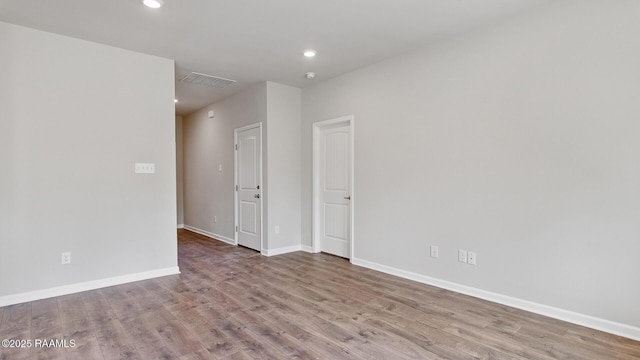 spare room featuring light hardwood / wood-style floors