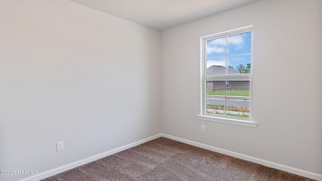 empty room featuring carpet flooring