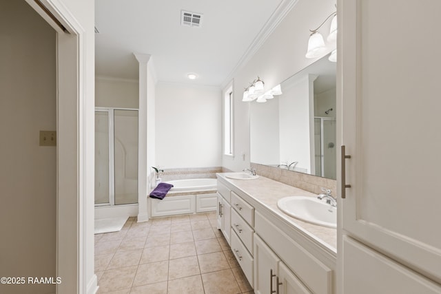 bathroom with tile patterned flooring, vanity, crown molding, and shower with separate bathtub