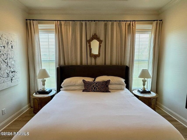 bedroom featuring crown molding and dark hardwood / wood-style floors