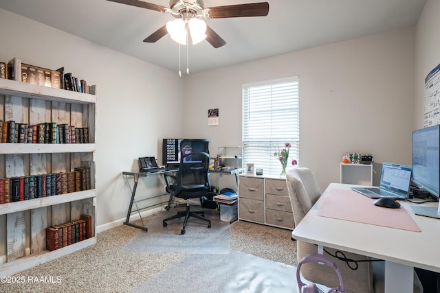 office area featuring ceiling fan, baseboards, and carpet flooring