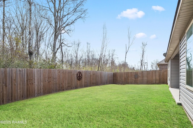 view of yard featuring a fenced backyard