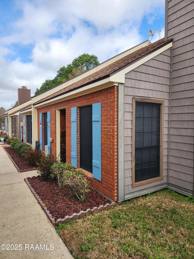 view of home's exterior with a yard