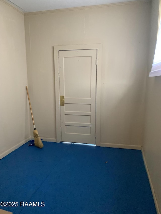 carpeted spare room with ornamental molding