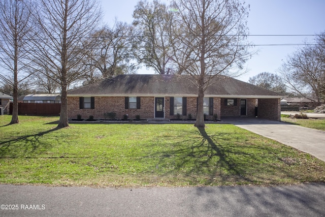 single story home featuring a front yard and a carport