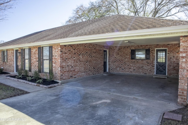 view of side of property with a carport