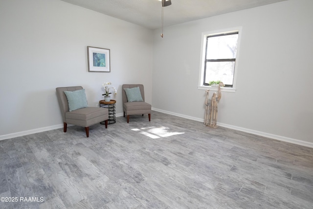 living area with light hardwood / wood-style flooring