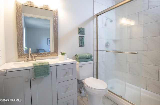 bathroom featuring vanity, toilet, and walk in shower