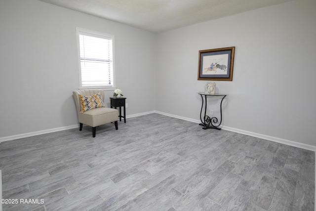 unfurnished room with light wood-type flooring