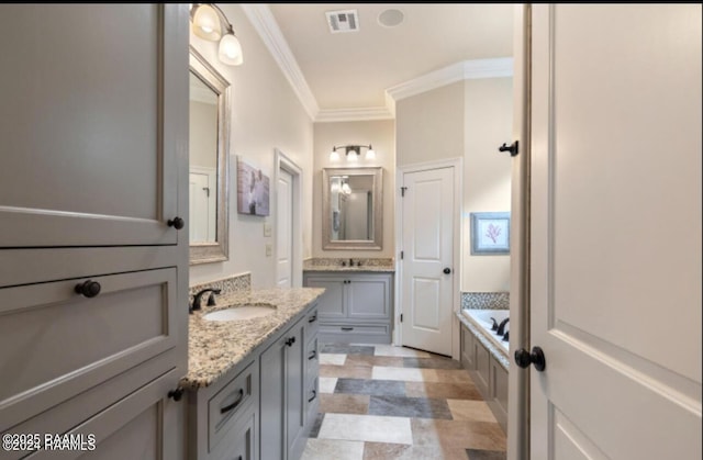 bathroom featuring visible vents, two vanities, a sink, crown molding, and a bath