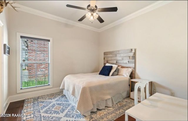 bedroom with crown molding, ceiling fan, and hardwood / wood-style flooring