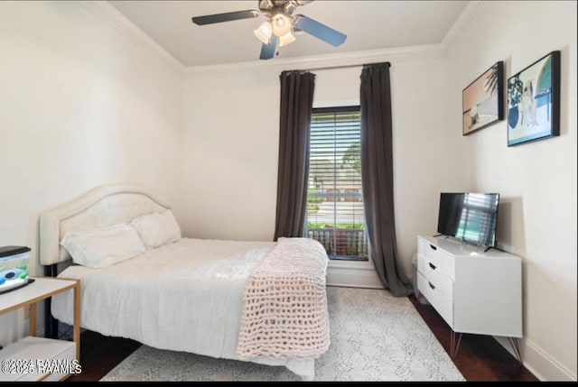 bedroom with ceiling fan, ornamental molding, and dark hardwood / wood-style floors