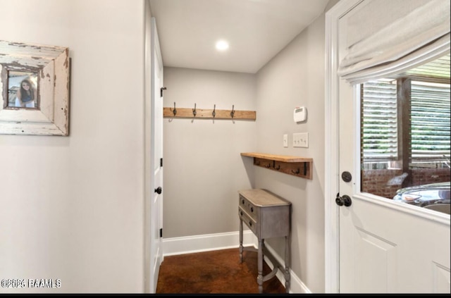 interior space featuring baseboards