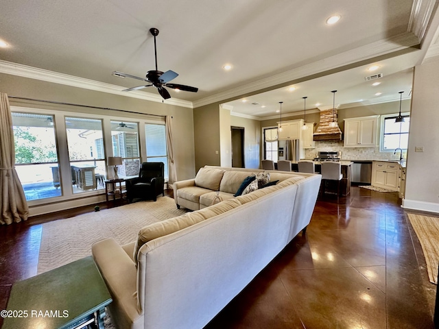 living area featuring plenty of natural light, recessed lighting, visible vents, and ceiling fan