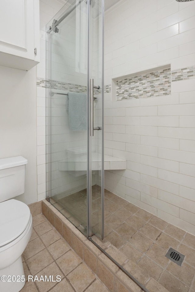 bathroom with toilet and walk in shower