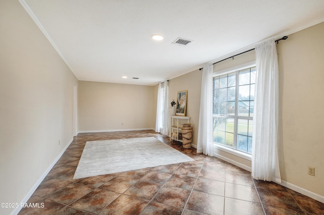 unfurnished room with crown molding