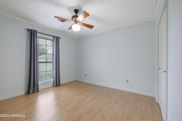 unfurnished room with crown molding, light hardwood / wood-style floors, and ceiling fan