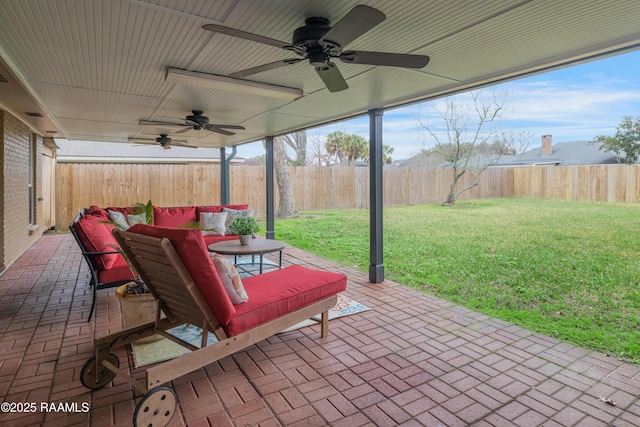 view of patio featuring ceiling fan