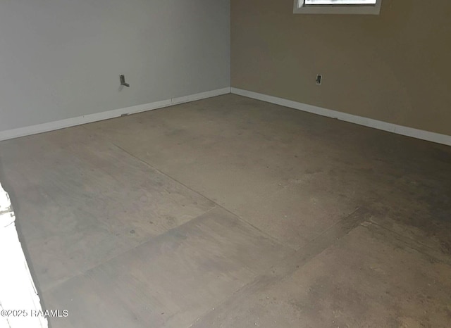 unfurnished room with concrete floors