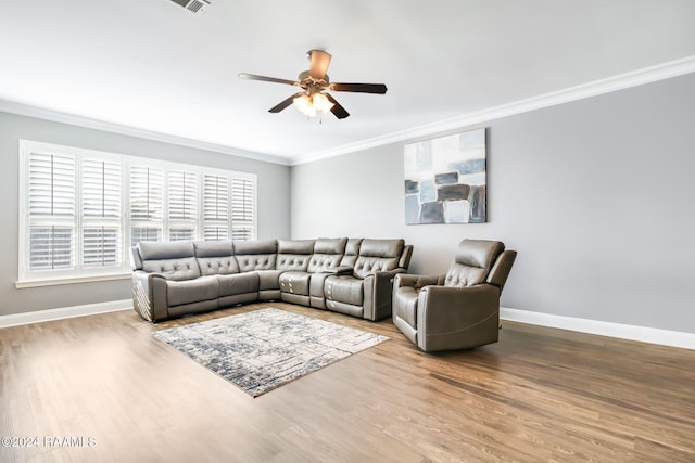 living room with crown molding, ceiling fan, and light hardwood / wood-style floors