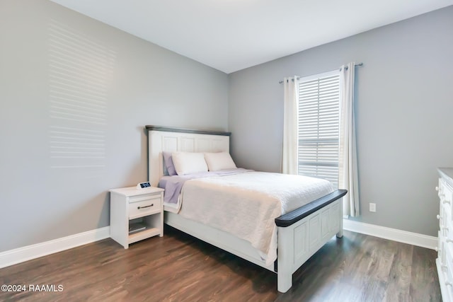 bedroom featuring dark wood-type flooring