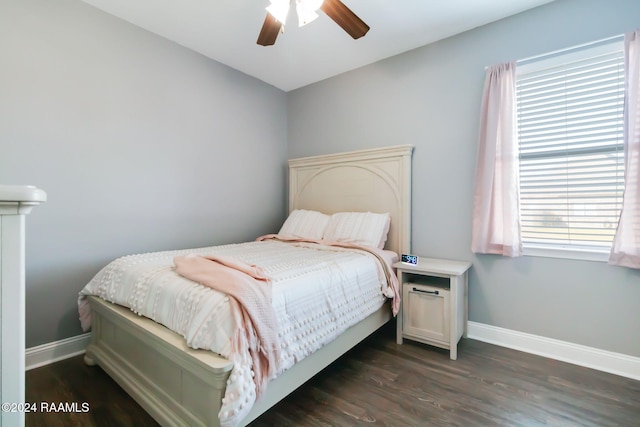 bedroom featuring dark hardwood / wood-style floors and ceiling fan