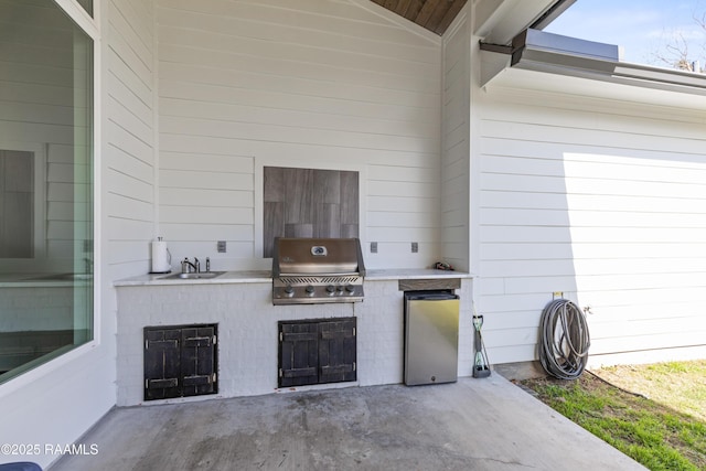 view of patio / terrace with area for grilling, sink, and grilling area