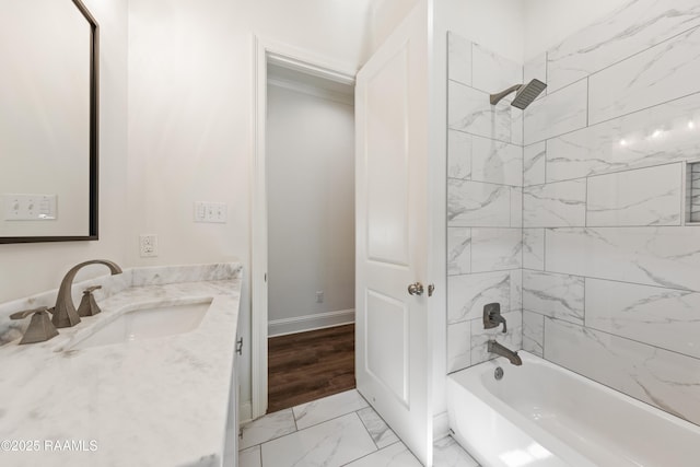 bathroom with vanity and tiled shower / bath combo