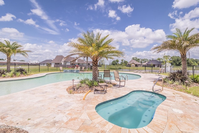 view of swimming pool with a patio area