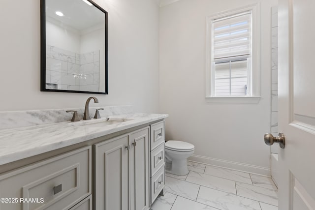 bathroom featuring vanity, a shower, and toilet