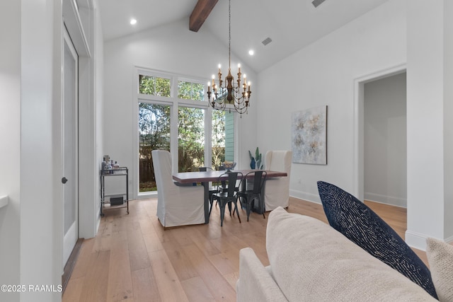 dining room with visible vents, a chandelier, beam ceiling, light wood-style flooring, and high vaulted ceiling