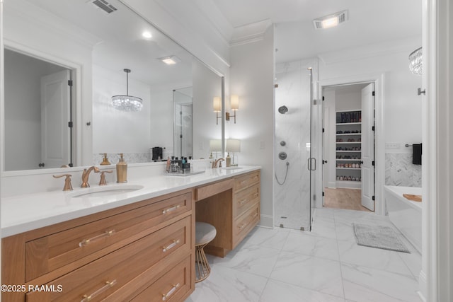 bathroom featuring ornamental molding, shower with separate bathtub, and vanity