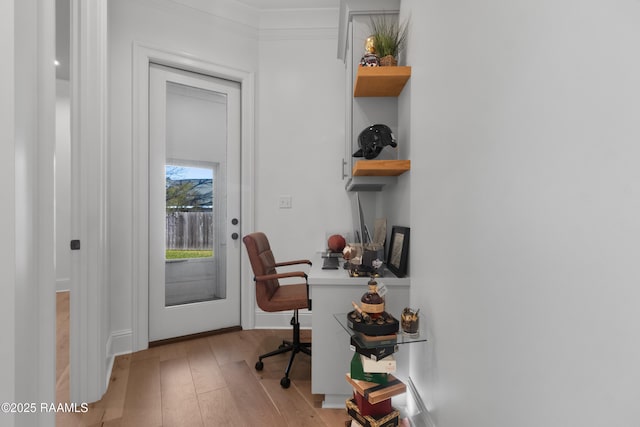 home office with light wood-style floors