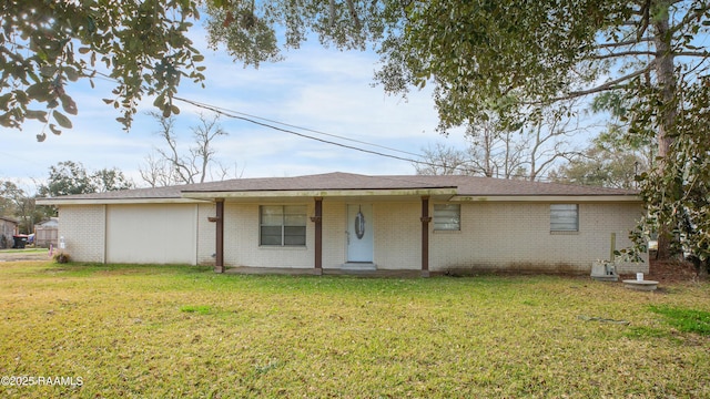 back of property with a lawn