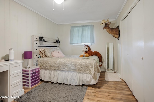 6903 W Congress, Duson, LA 70529 - bedroom featuring ornamental molding, light wood-style floors, and a closet