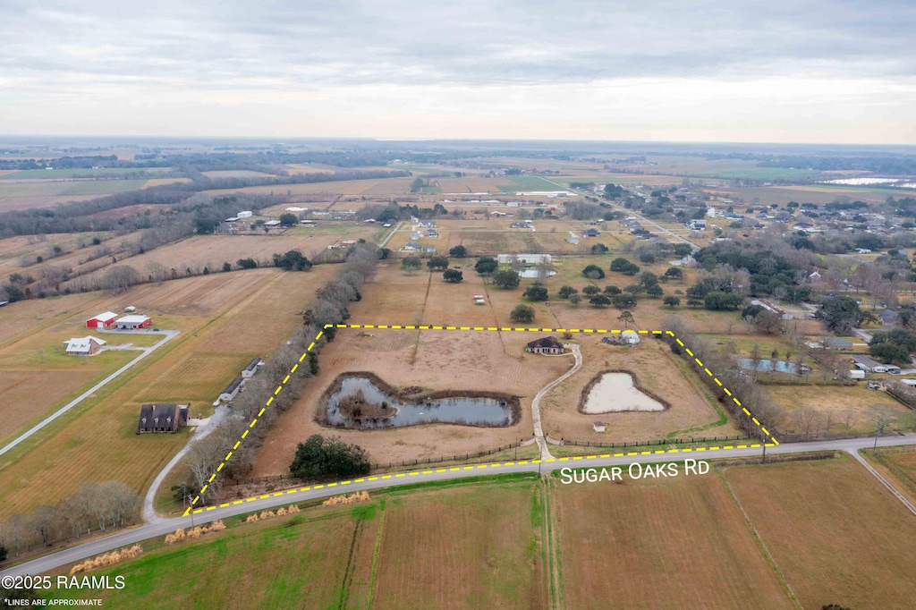 birds eye view of property featuring a rural view