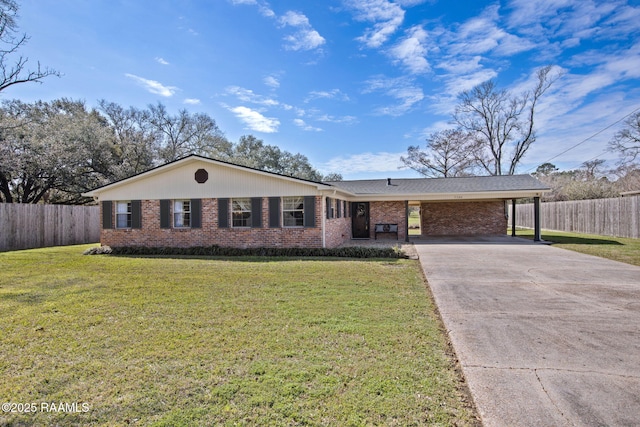 ranch-style home featuring concrete driveway, brick siding, fence, and a front lawn