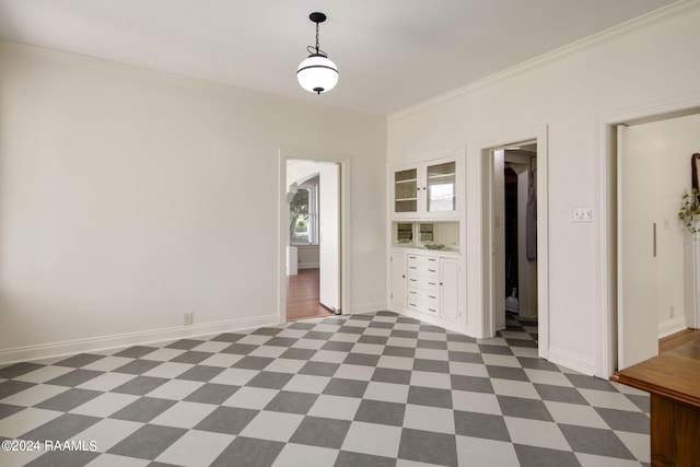 unfurnished room with crown molding