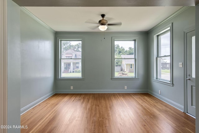 unfurnished room featuring ceiling fan, ornamental molding, and light hardwood / wood-style floors