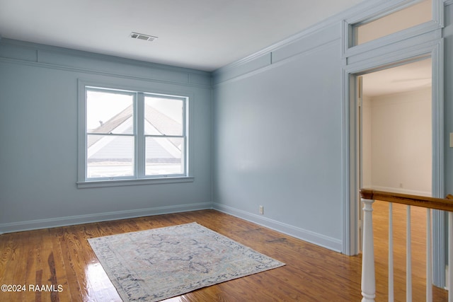 empty room with wood-type flooring