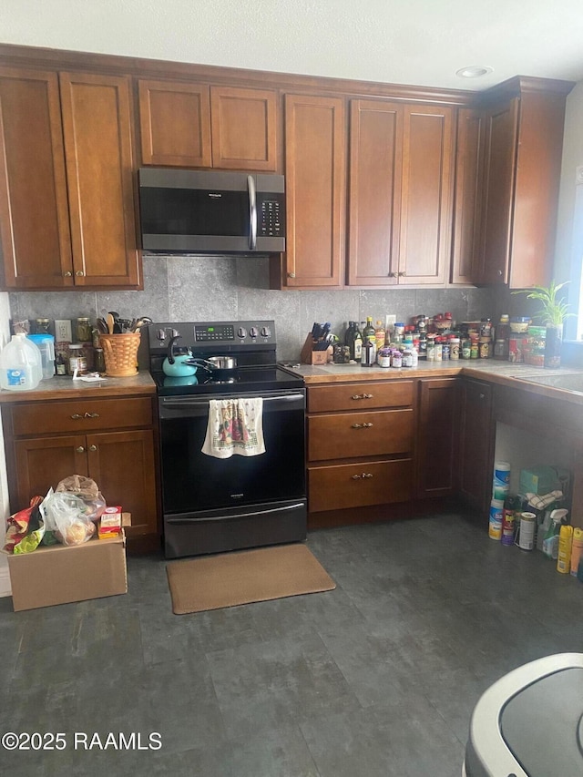 kitchen with range with electric cooktop and backsplash