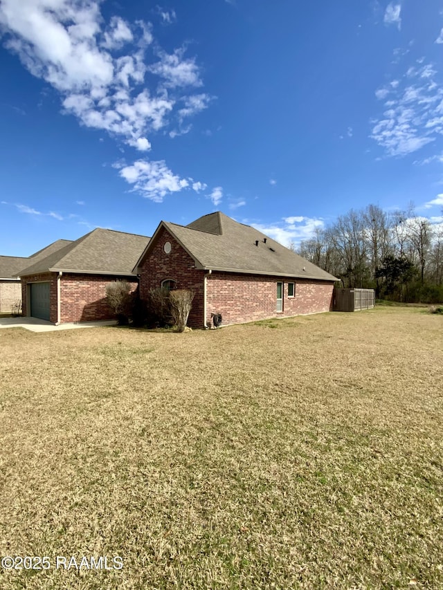 exterior space with a garage and a front yard