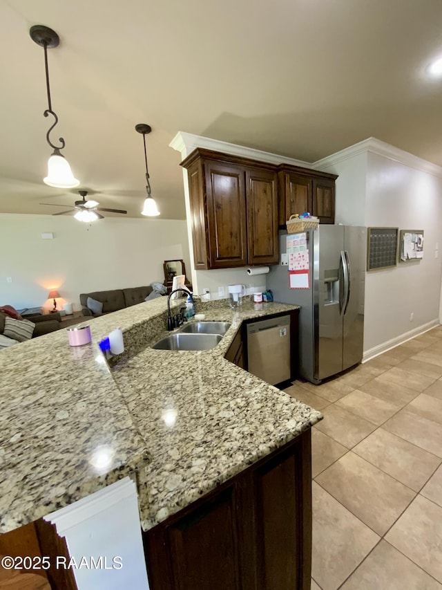 kitchen featuring sink, ceiling fan, hanging light fixtures, stainless steel appliances, and kitchen peninsula