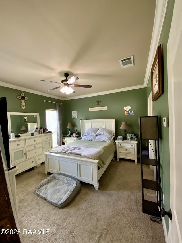 bedroom with ornamental molding, carpet floors, and ceiling fan